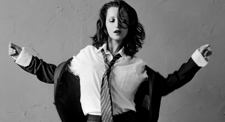 black and white photo of Ksenia swing dancing laugh